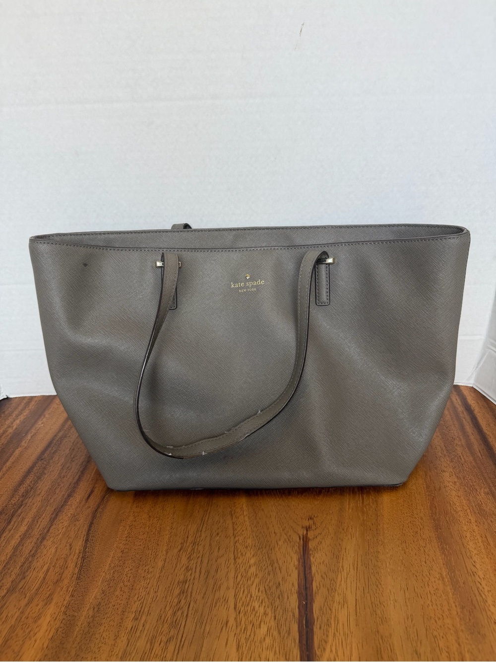 kate spade gray leather tote with gold logo